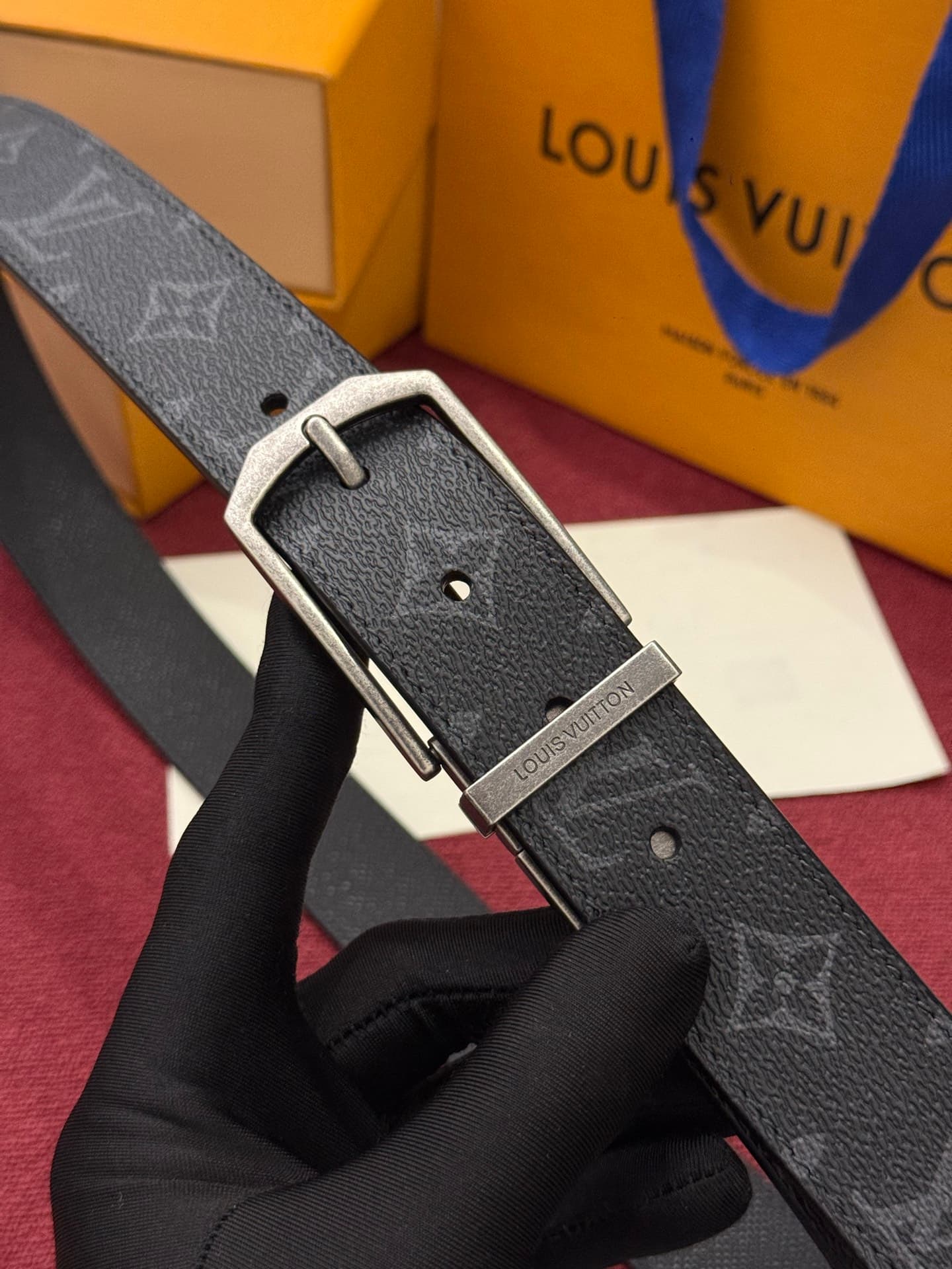 C32955 This Slender double-sided belt features Monogram-coated canvas and leather materials, along with intricate buckles and metal bands adorned with Louis Vuitton logos. — image 1