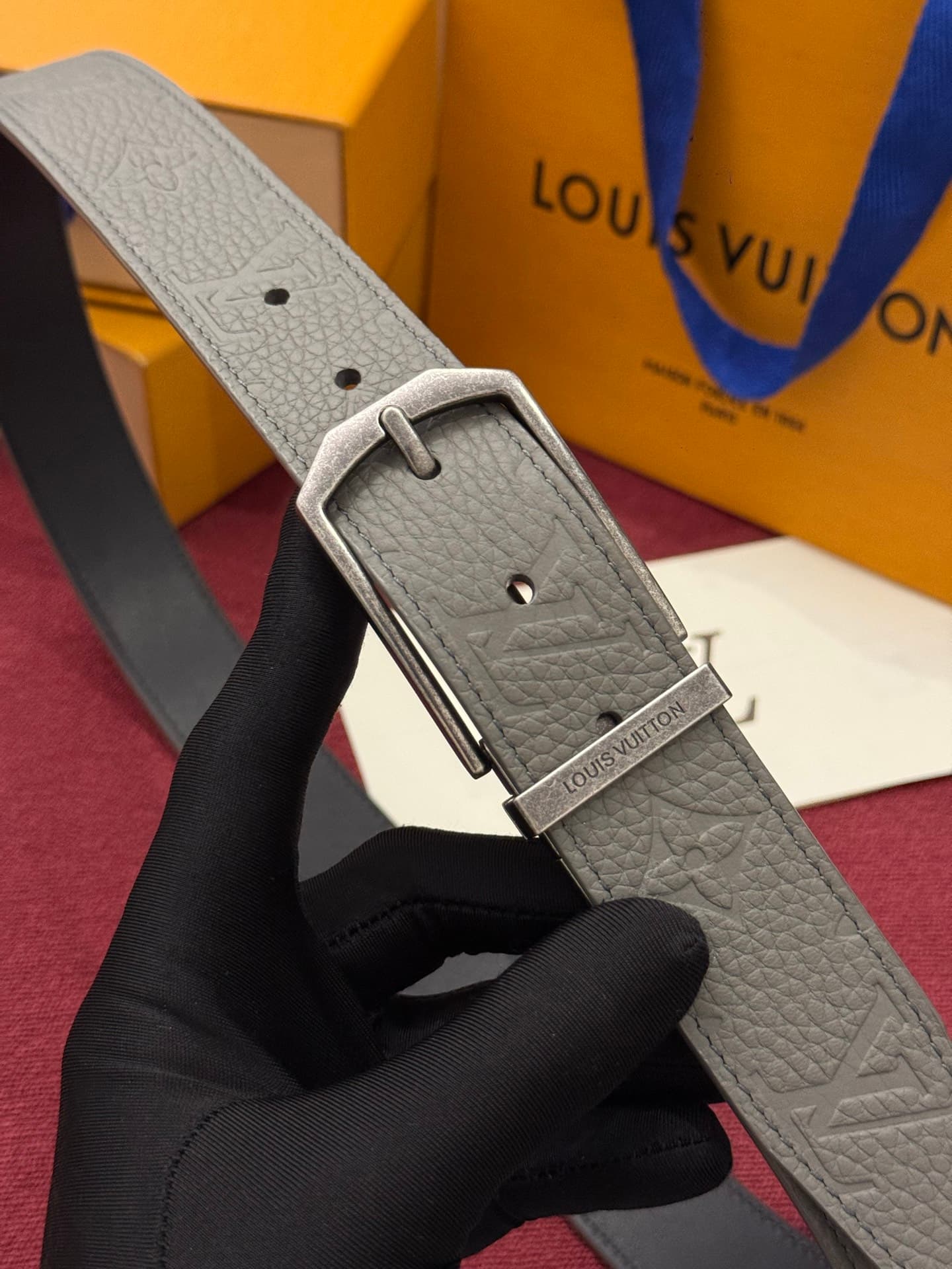 C32951 This Slender double-sided belt is made of Monogram leather, offering a stylish look. It features intricate buckles and metal bands with Louis Vuitton logos. — image 1