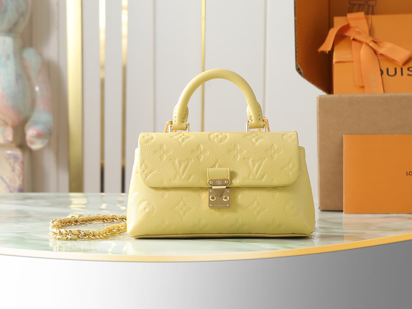 C5186 【Top-quality original items, exclusive real photos】M29378 yellow, full leather embossing, chain bag collection. New season model. NANO MADELEINE handbag. M12145 milky white. This Nano Madeleine handbag features Monogram Empreinte leather, creating a — image 1