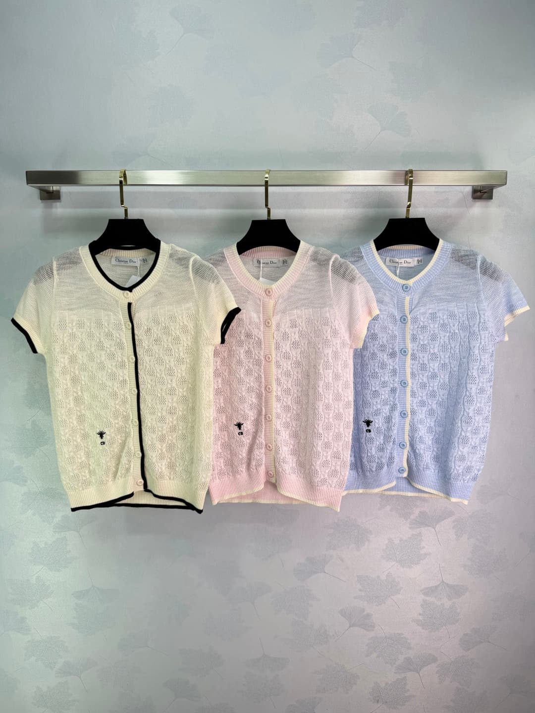 C18378 🆕Dio*26 – New spring/summer knitted sweater with open patterns. Lightweight and breathable; extremely comfortable for spring/summer wear! Short sleeves + round neck design; buttons on the front make it easy to put on and take off. The open pattern — image 1