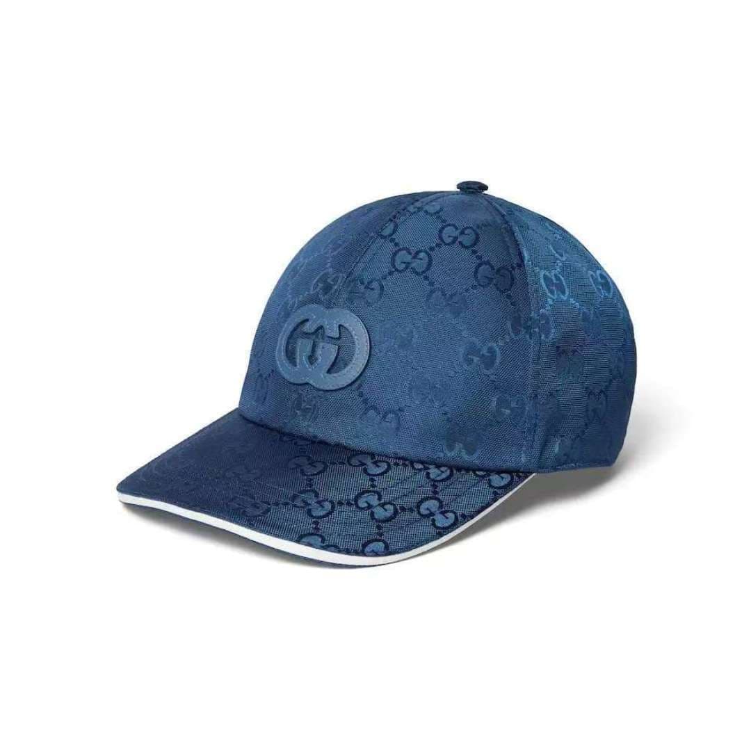 C29824 Gucci 2025 Early Autumn Collection presents a variety of energetic accessories. This baseball cap is crafted with GG nylon, adorned with interlocking G embroidery patches, bringing a unique and distinctive touch. — image 1