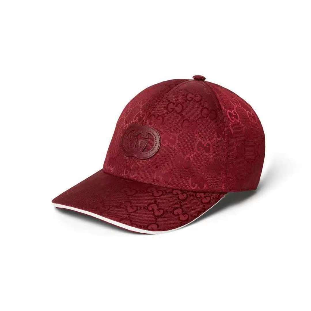 C29823 Gucci 2025 Early Autumn Collection presents a variety of energetic accessories. This baseball cap is crafted with precision using GG nylon, adorned with interlocking G embroidery patches, bringing a unique and elegant touch. — image 1