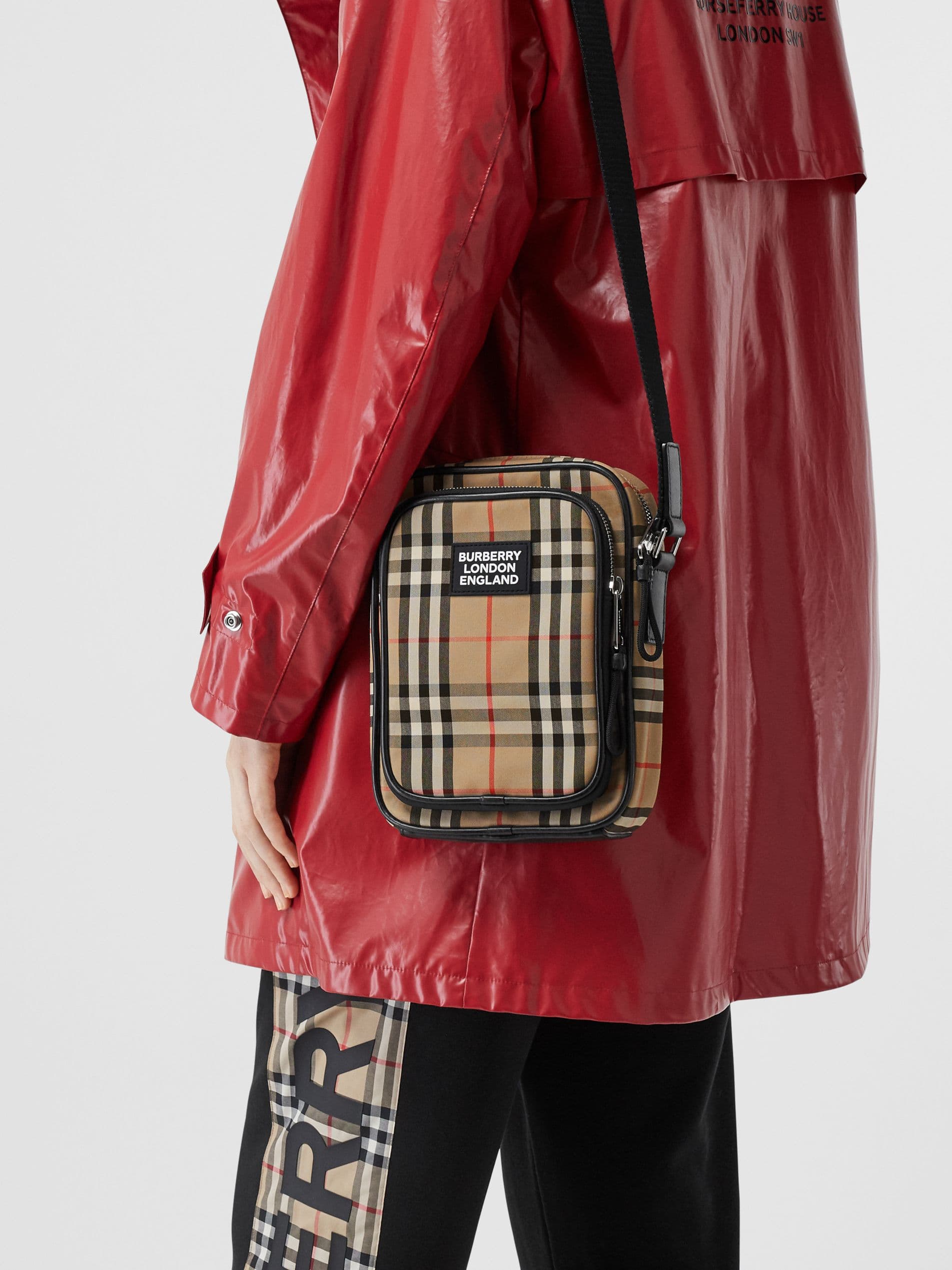 C80 280.00 B-family 1831 – a latest model, elegantly designed crossbody bag. It features checkered patterns on cotton panels, along with smooth leather trim. The design includes adjustable net nylon straps, adjustable crossbody straps, one zipper pocket; — image 1